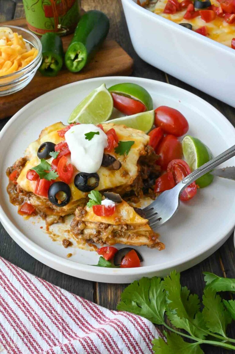 Taco lasagna on a plate with a fork.